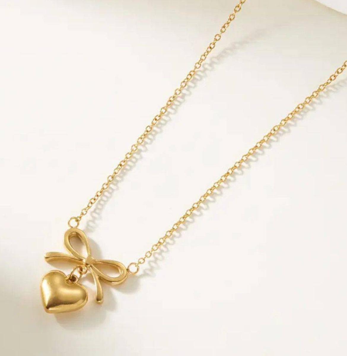 Gold-Toned Bow Heart Pendant with Chain