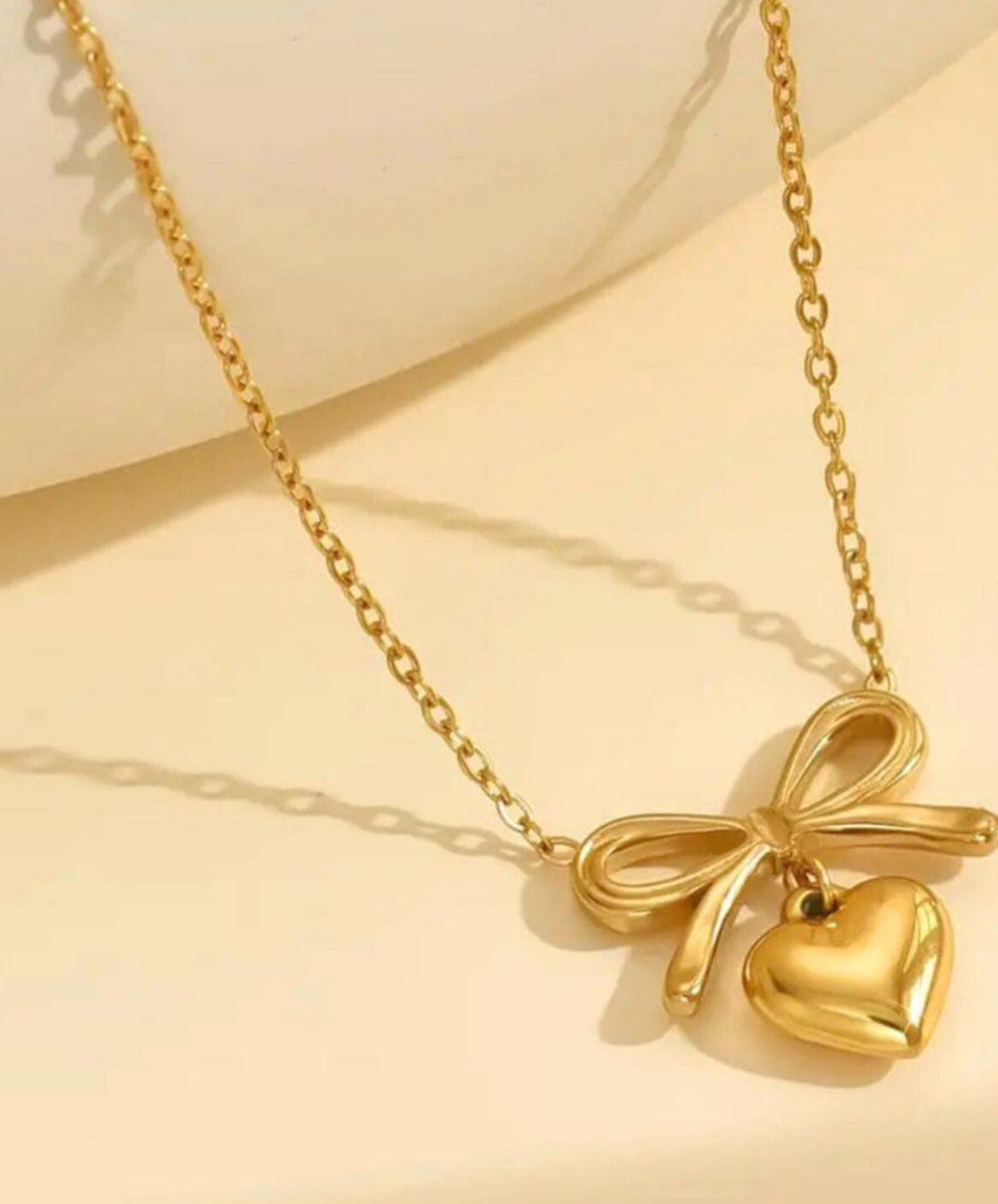 Gold-Toned Bow Heart Pendant with Chain